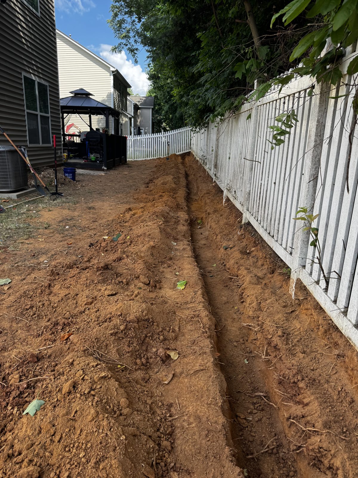Drainage trench dug along the fence line