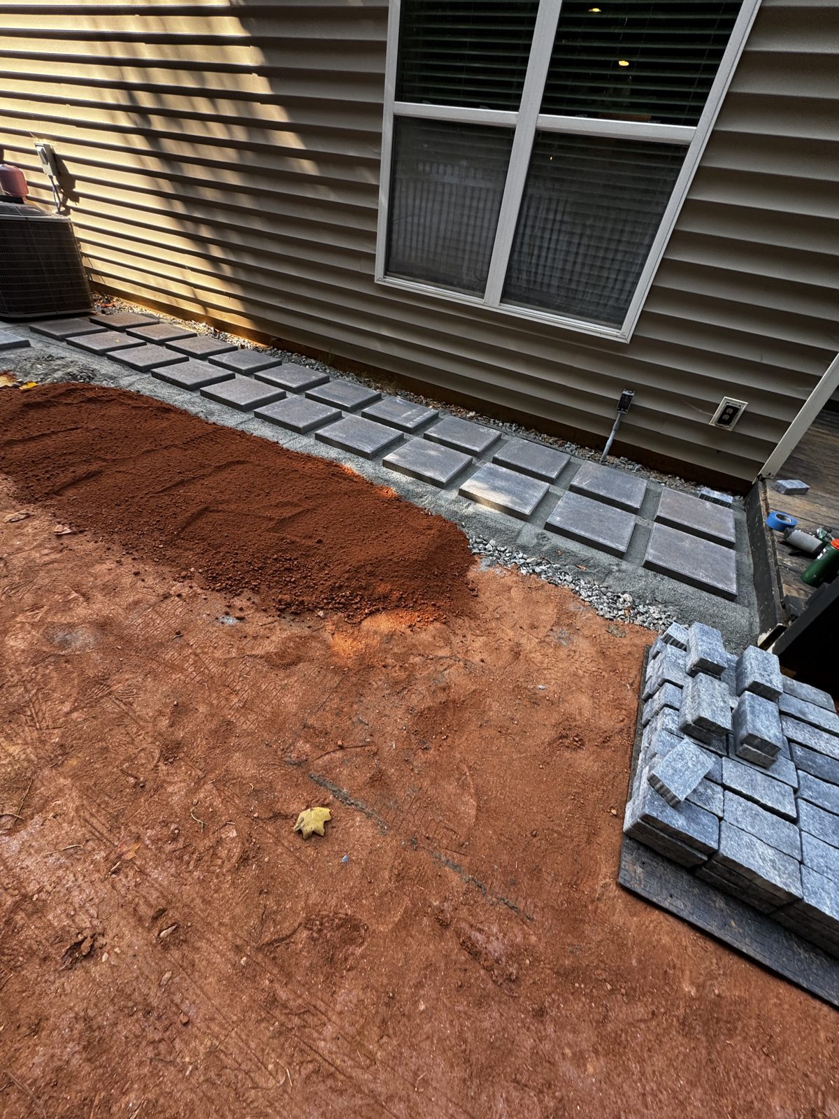 Paver walkway and border being laid